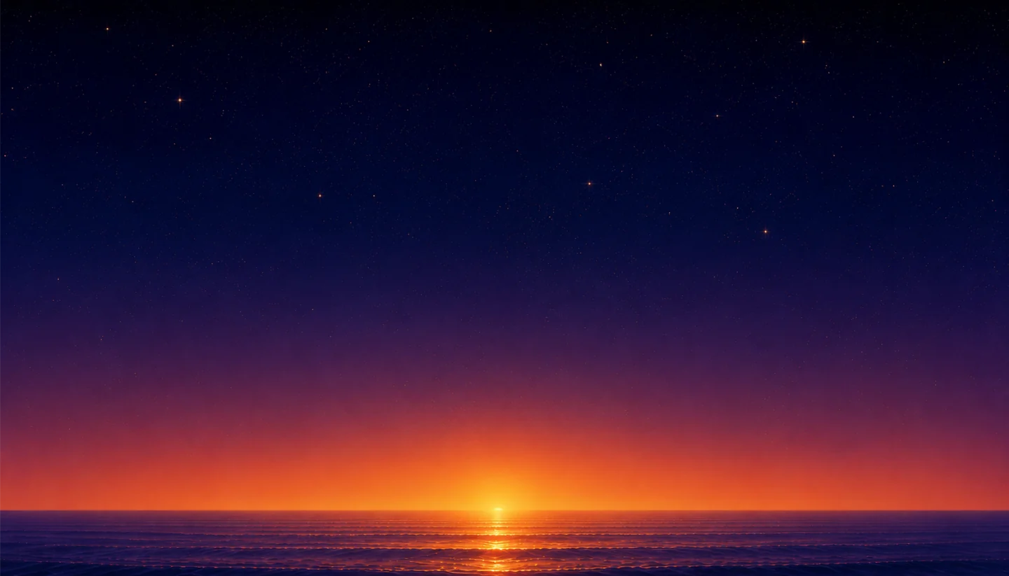 A sunrise glowing on the horizon over a calm, starlit ocean